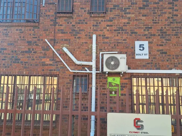 Exterior plumbing pipework installed at a commercial building