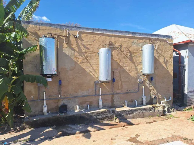 Backup water storage tanks installed on an exterior wall