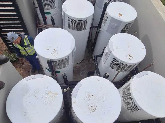Multiple backup water storage tanks installed on a rooftop
